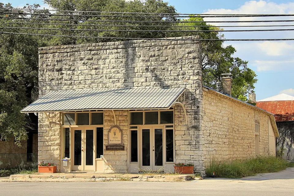 Historic stone J. L. Patterson Building in downtown Dripping Springs